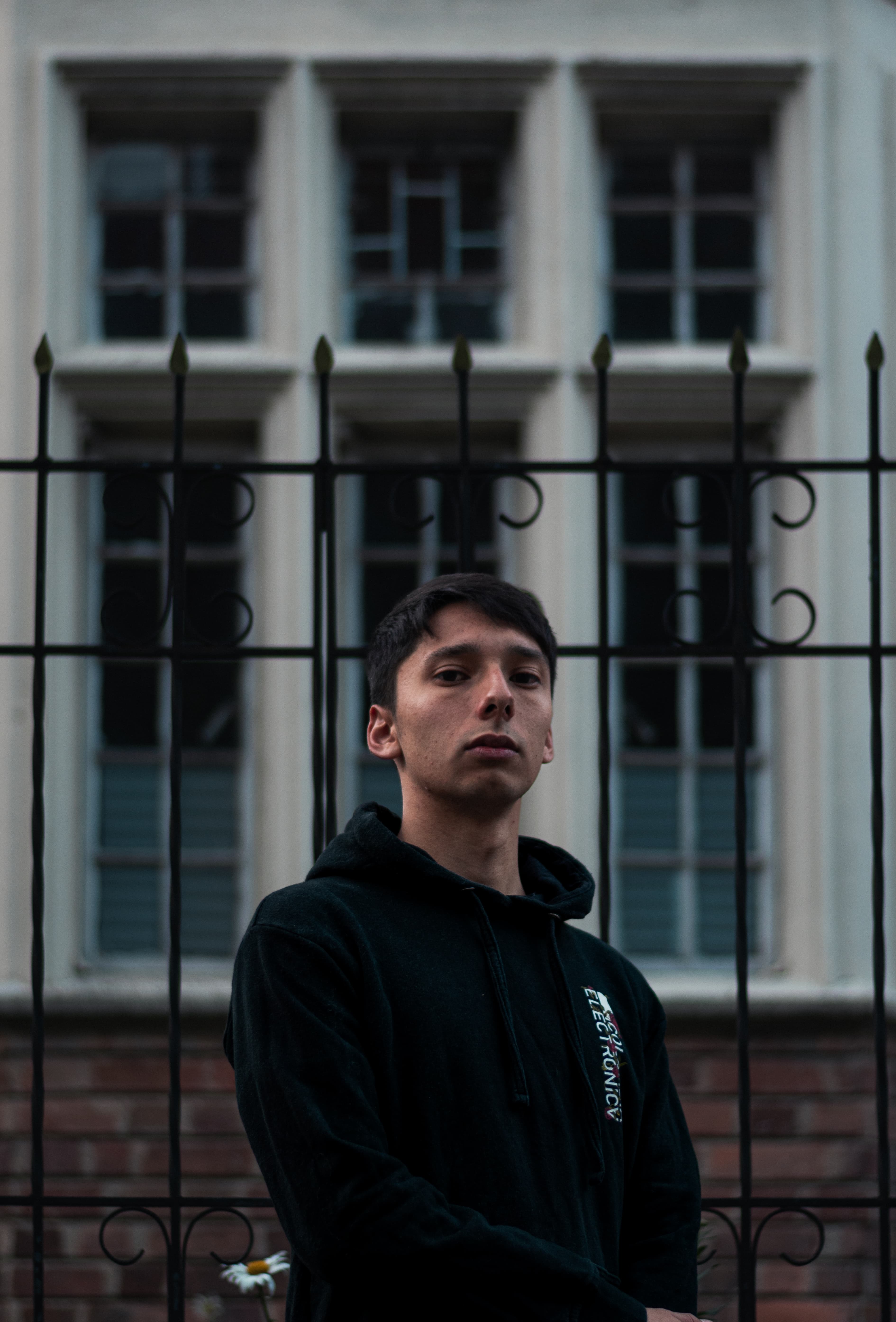 ANDY EMBER in front of an urban Bogota building facade